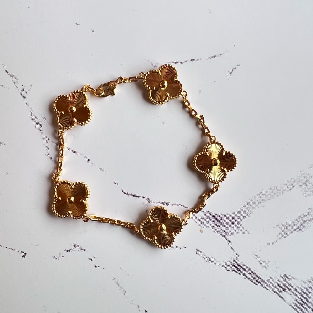 Gold four leaf clover bracelet